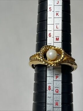 Vintage Avon ring with adjustable sizing 
Gold Pearl Twist Knot Ring